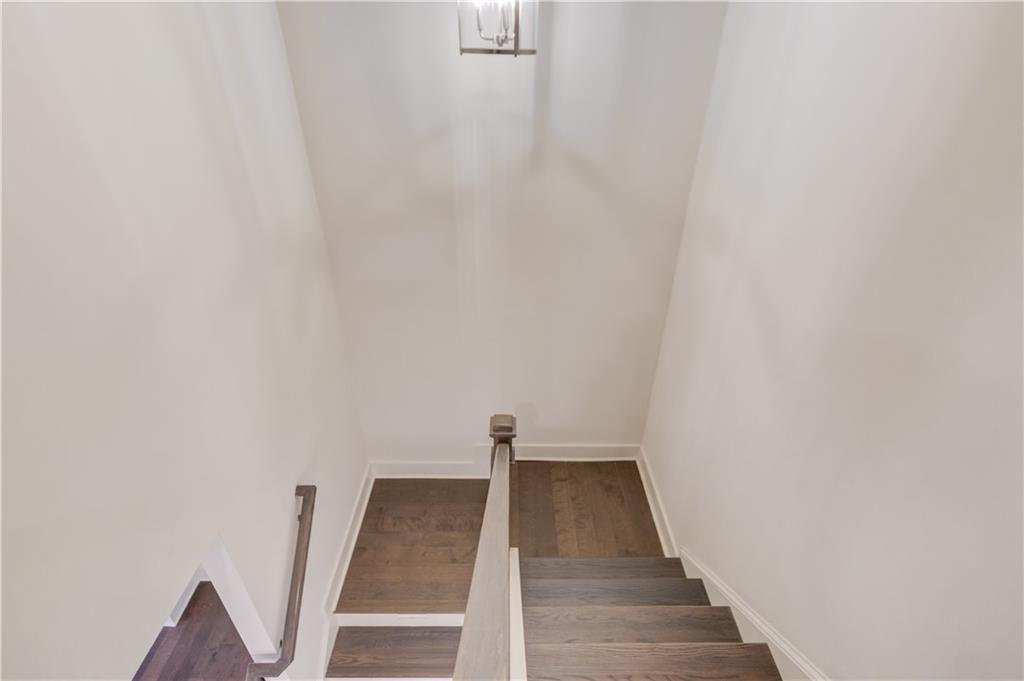 74 Cannon Trace Drive Winder, GA 30680 - Photo 17 of 42 a view of a hallway with wooden floor and white walls