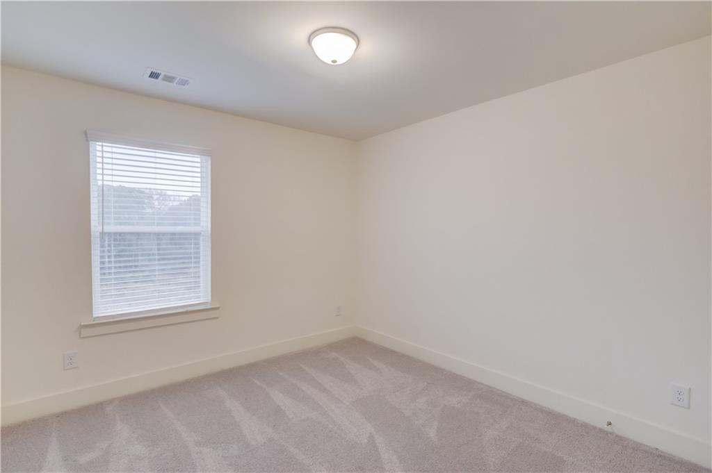 74 Cannon Trace Drive Winder, GA 30680 - Photo 30 of 42 an empty room with a window