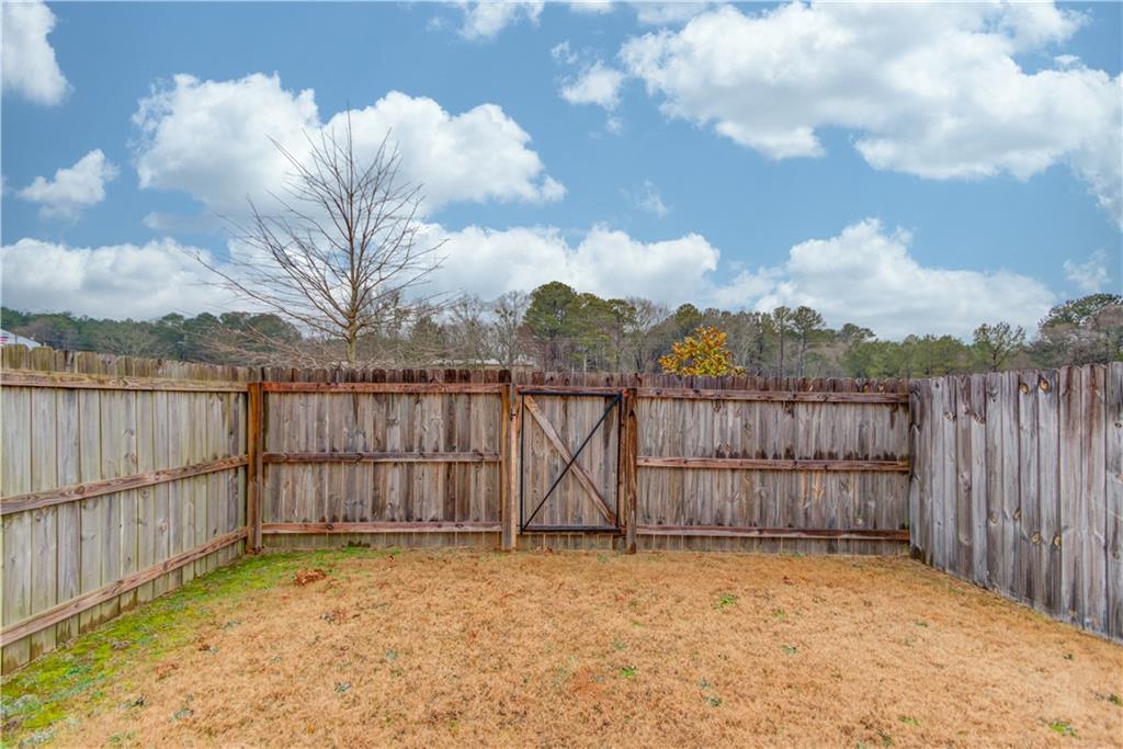 74 Cannon Trace Drive Winder, GA 30680 - Photo 34 of 42 a view of terrace with wooden fence