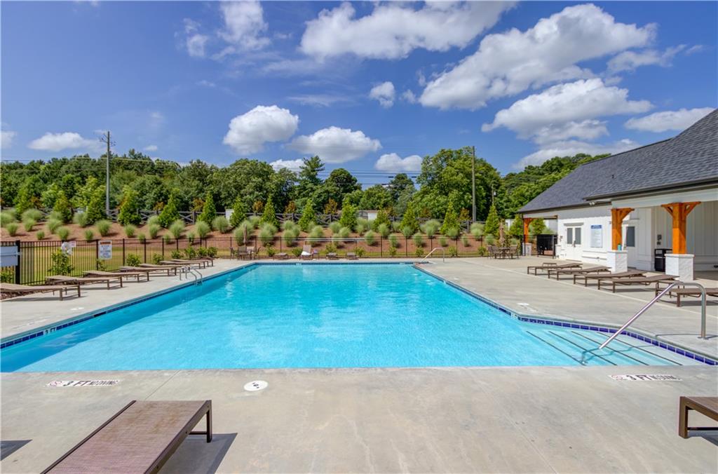 74 Cannon Trace Drive Winder, GA 30680 - Photo 41 of 42 a view of a swimming pool with an outdoor space and seating area