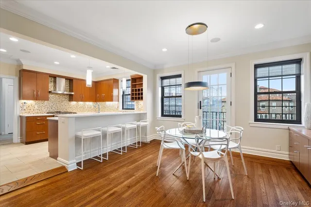 a living room with fireplace furniture and a wooden floor