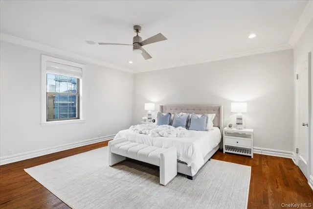 a bedroom with a bed and a night stand