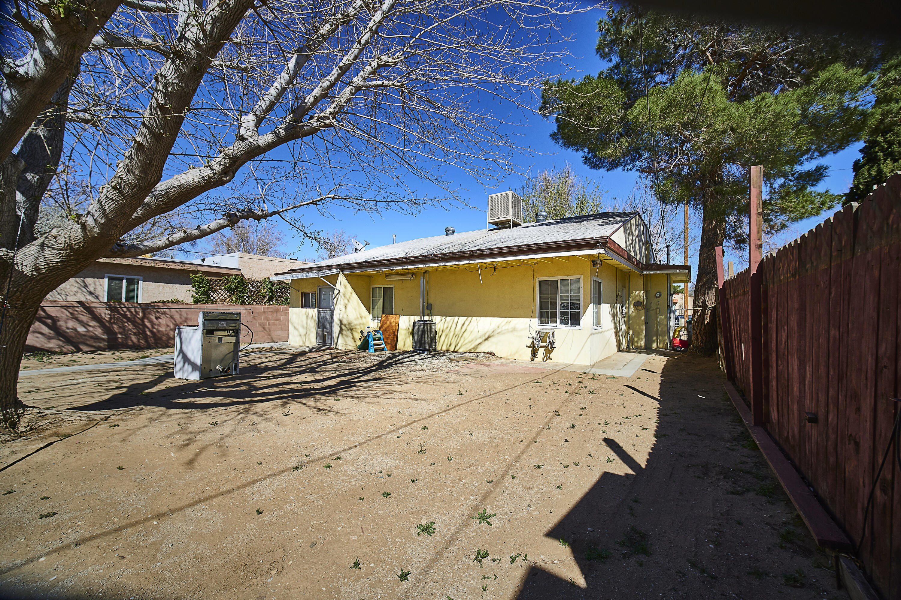 44655 Fig Avenue Lancaster, CA 93534 - Photo 14 of 16 a house with trees in front of it