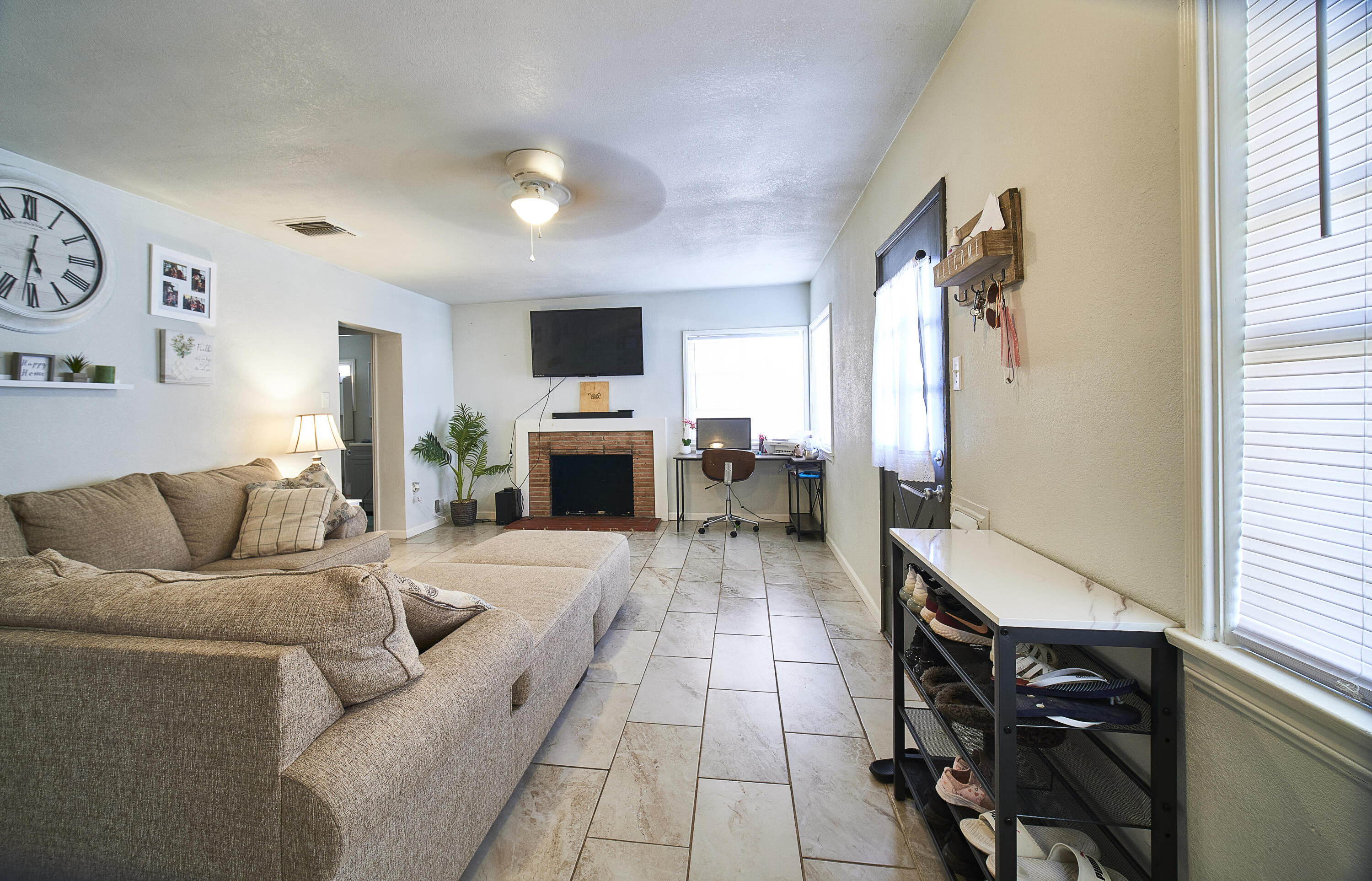 44655 Fig Avenue Lancaster, CA 93534 - Photo 2 of 16 a living room with furniture and a flat screen tv
