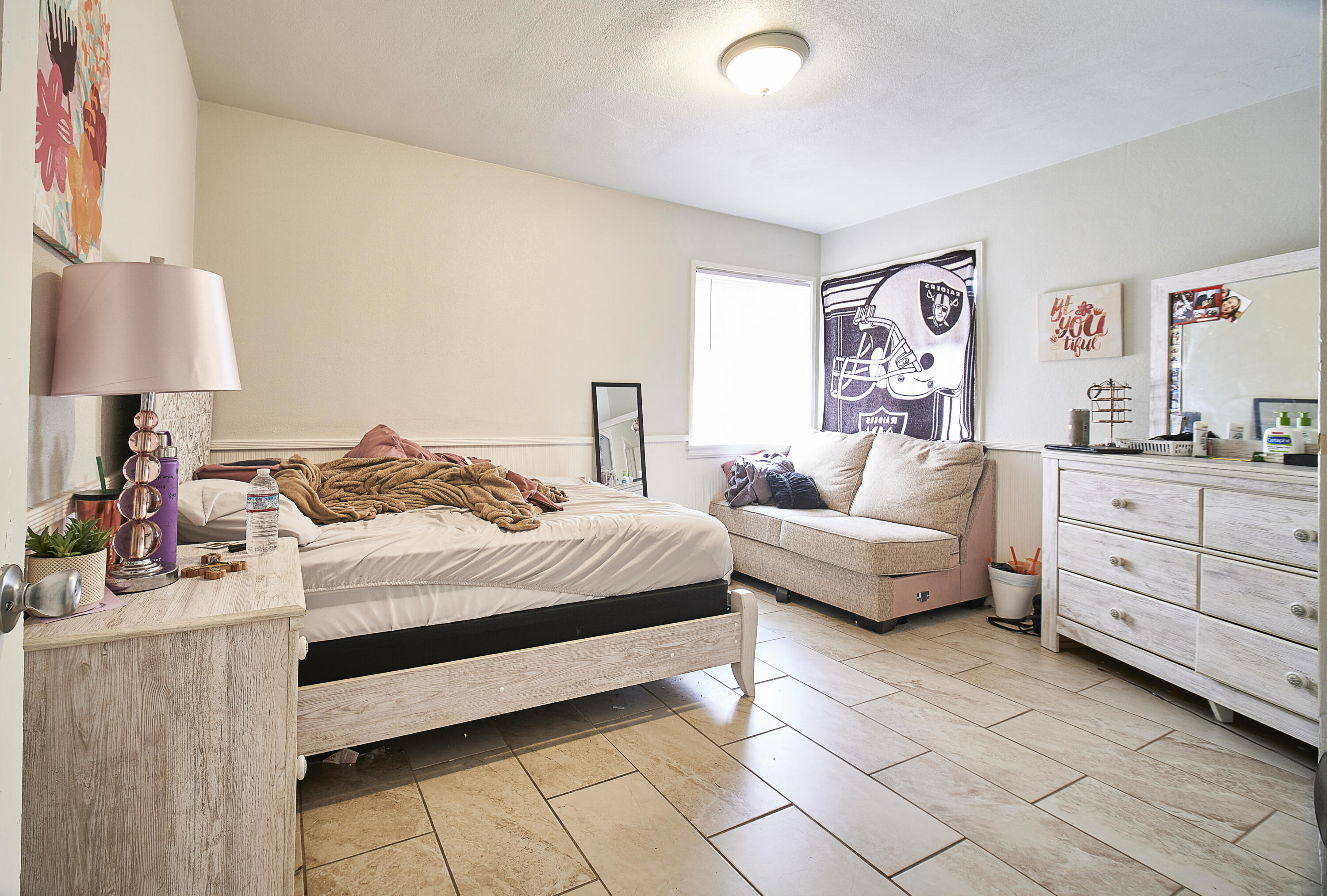 44655 Fig Avenue Lancaster, CA 93534 - Photo 7 of 16 a bedroom with a bed and a dresser