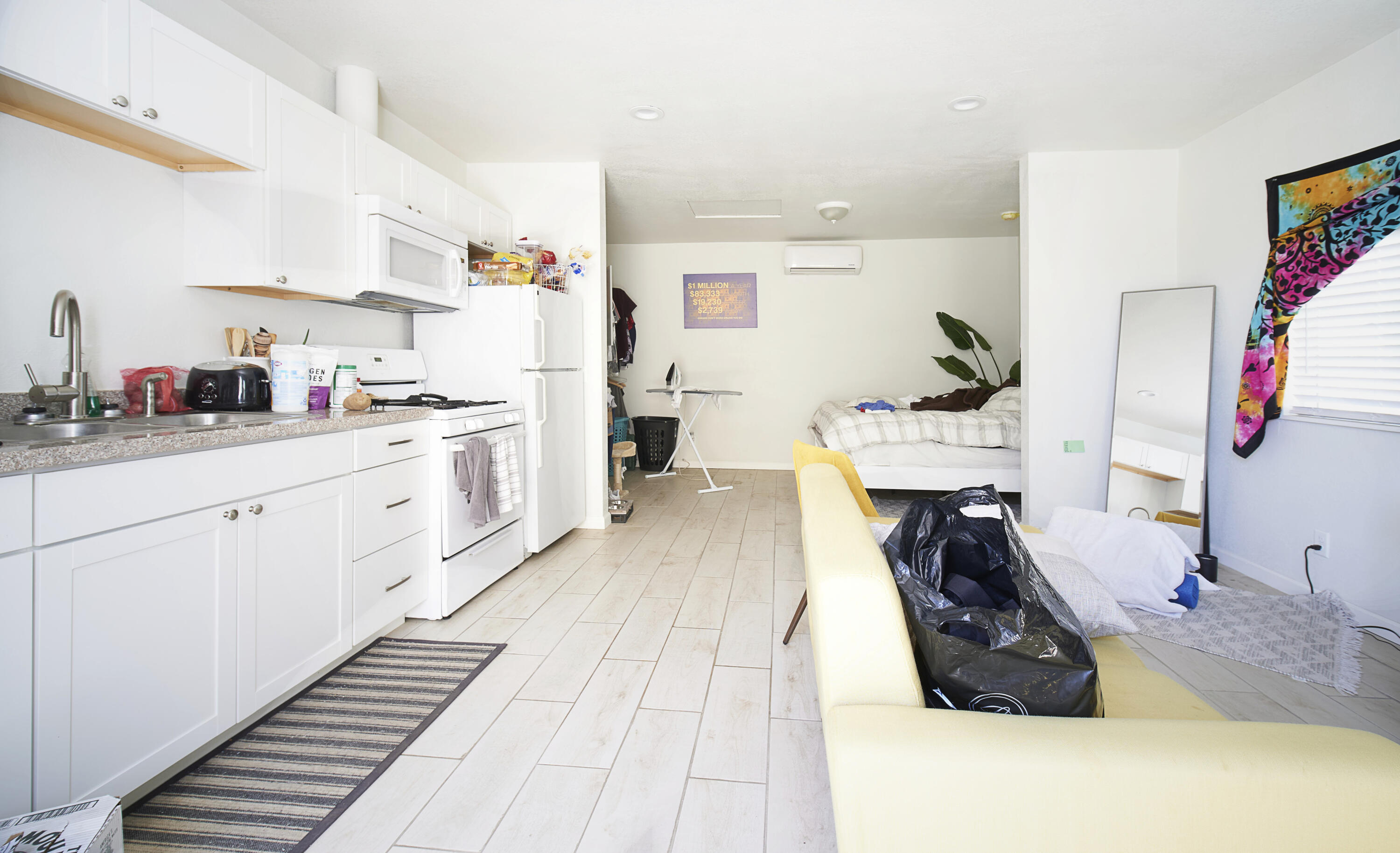 44655 Fig Avenue Lancaster, CA 93534 - Photo 9 of 16 a kitchen with a sink a stove and cabinets