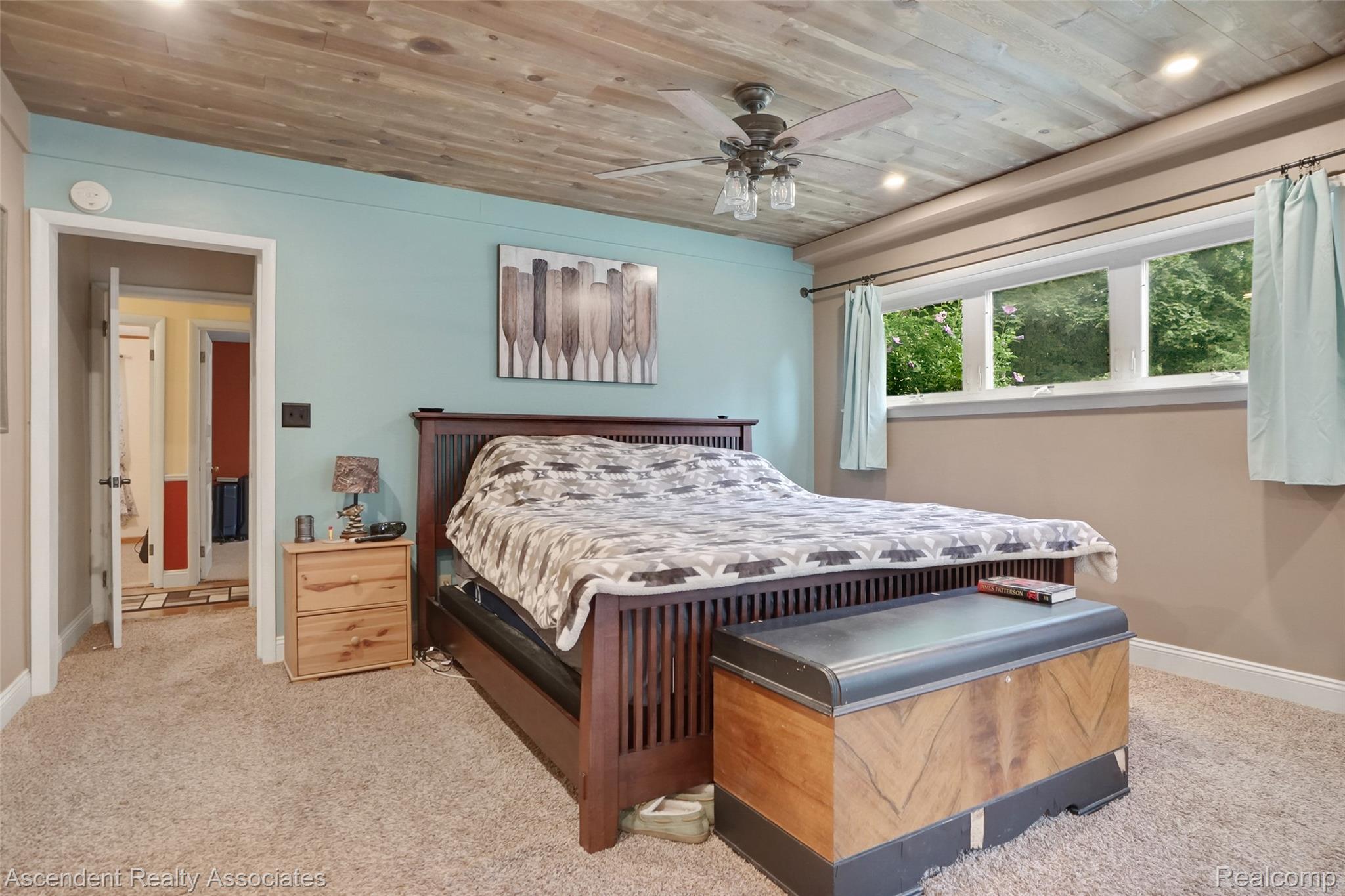 6157 Blue Beech Court Rochester, MI 48306 - Photo 13 of 30 1st Floor Large master bedroom, in suite full bathroom, walk in closet, sitting area or office. Wood-finish plank ceiling with recessed lighting