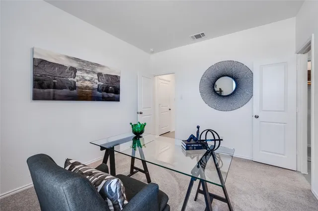 a view of a livingroom with furniture and furniture