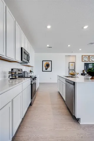a large kitchen with cabinets