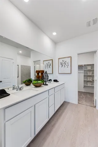 a kitchen with sink and cabinets
