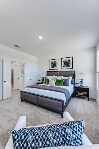 a bedroom with furniture and a couch