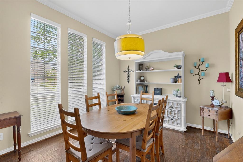 4004 White Porch Road Plano, TX 75024 - Photo 7 of 40 a view of a dining room with furniture and wooden floor