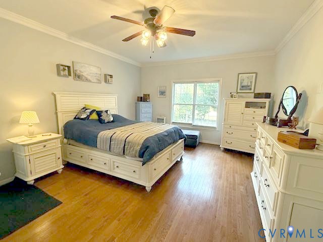 11283 Winding River Road Providence Forge, VA 23140 - Photo 18 of 28 Primary bedroom on first floor w/ hardwood floors