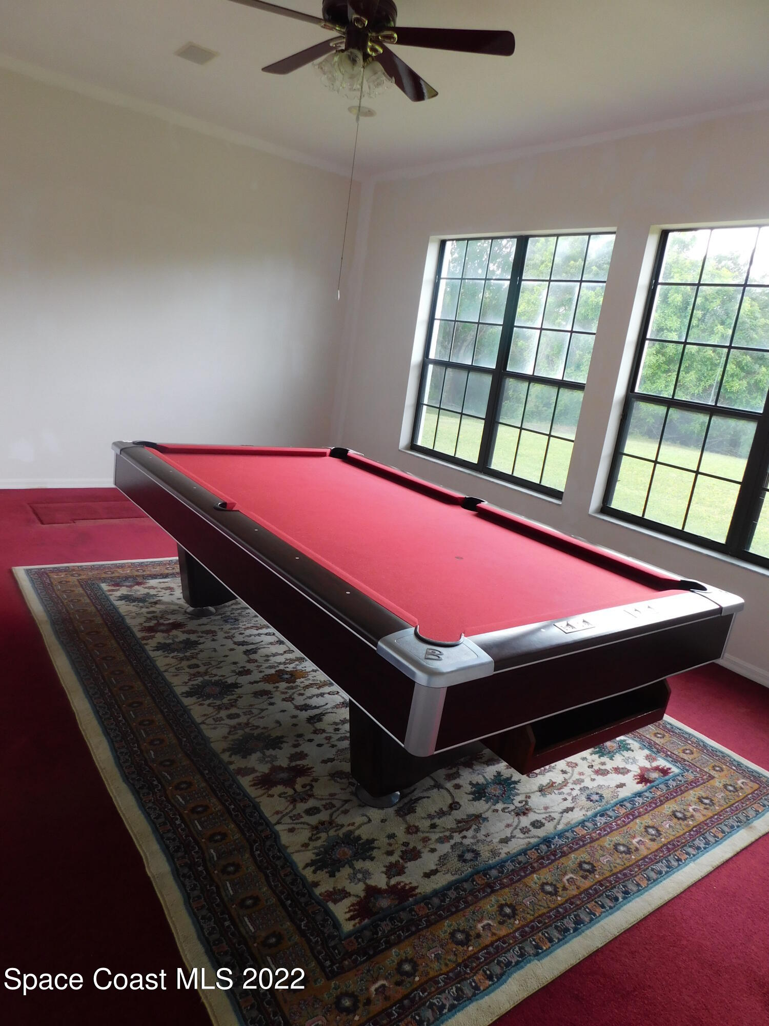 4508 Canard Road Melbourne, FL 32934 - Photo 11 of 34 a room with pool table and windows
