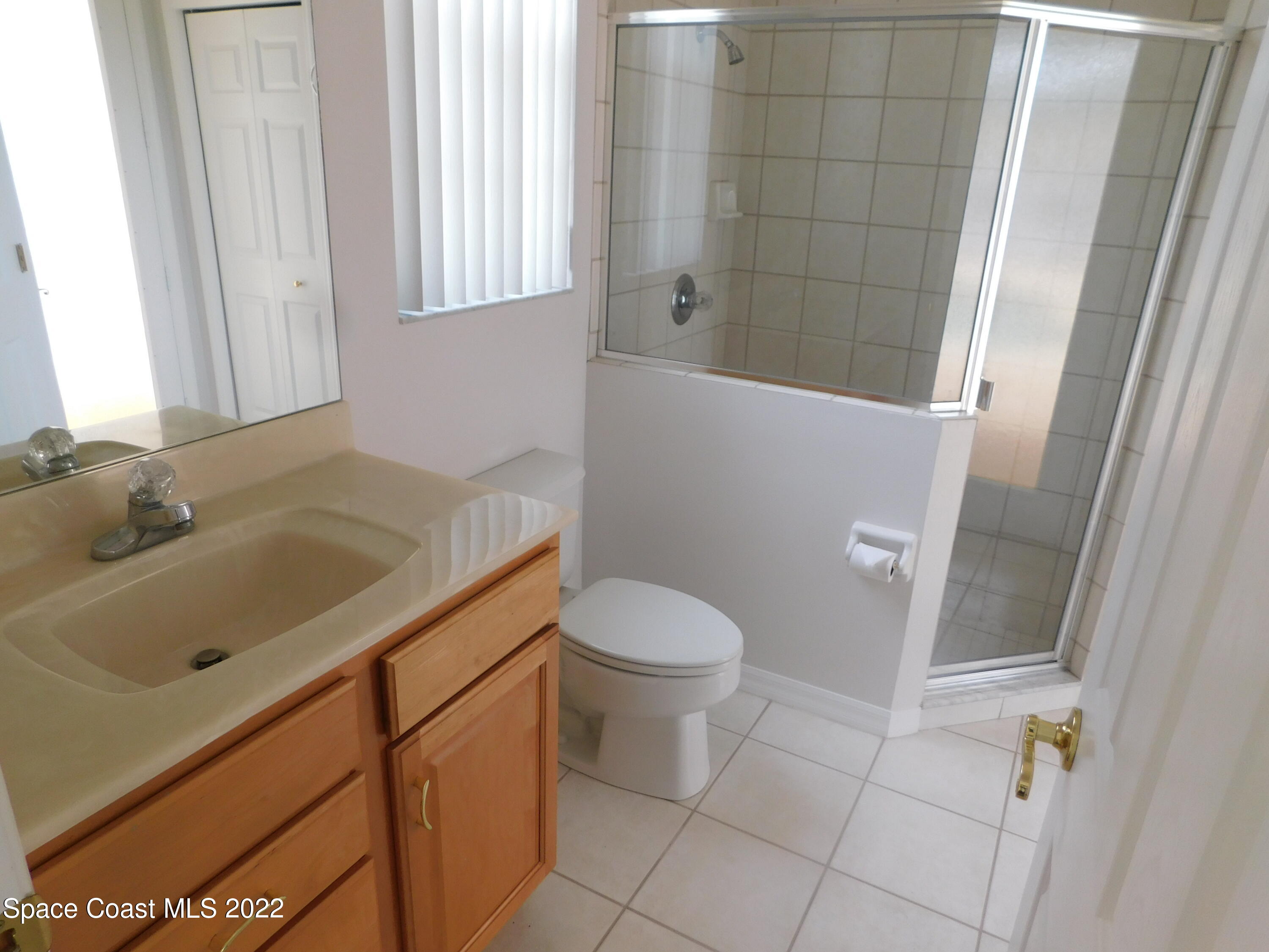 4508 Canard Road Melbourne, FL 32934 - Photo 18 of 34 a bathroom with a sink and toilet