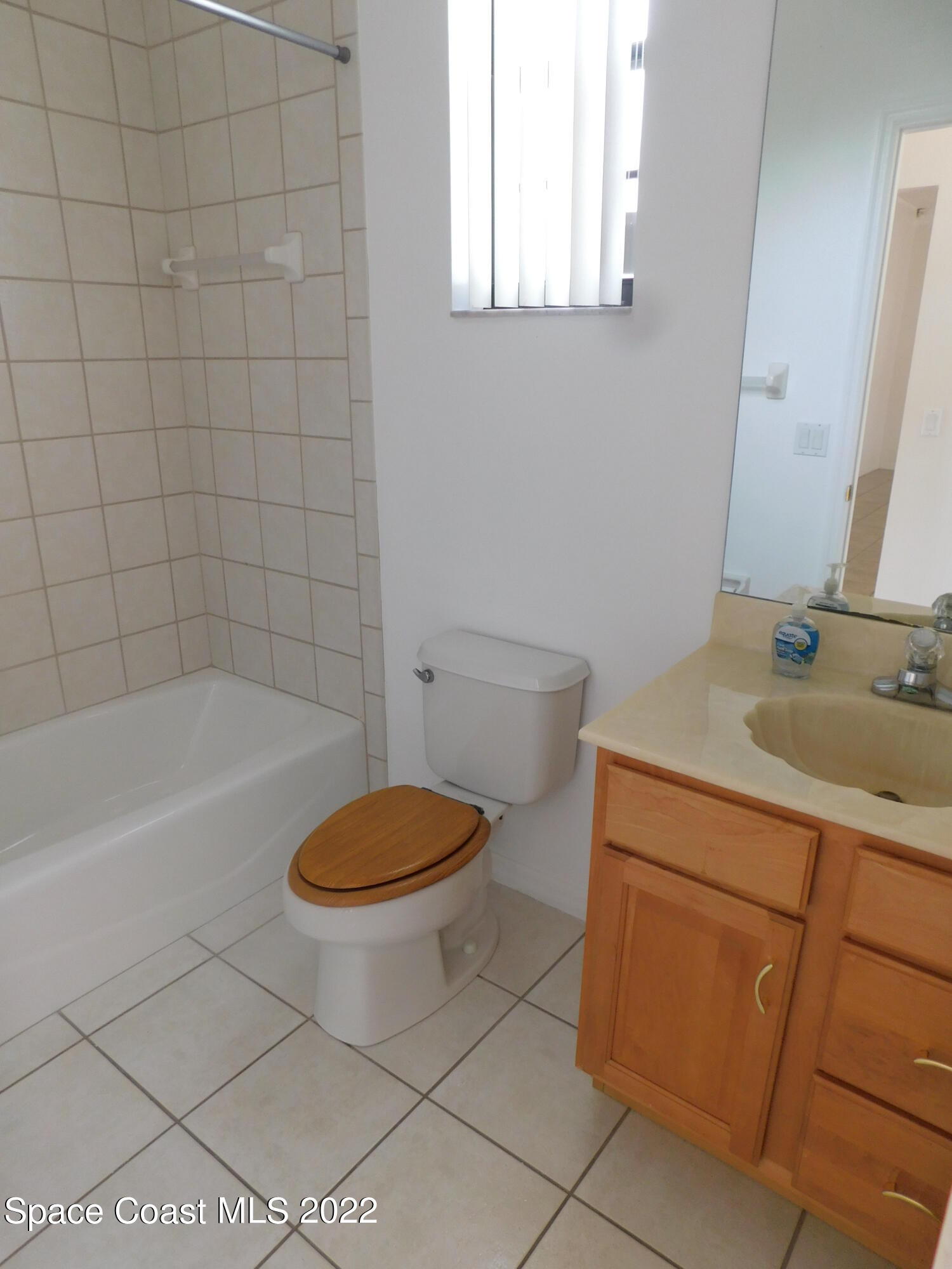 4508 Canard Road Melbourne, FL 32934 - Photo 25 of 34 a bathroom with a sink a toilet and bathtub
