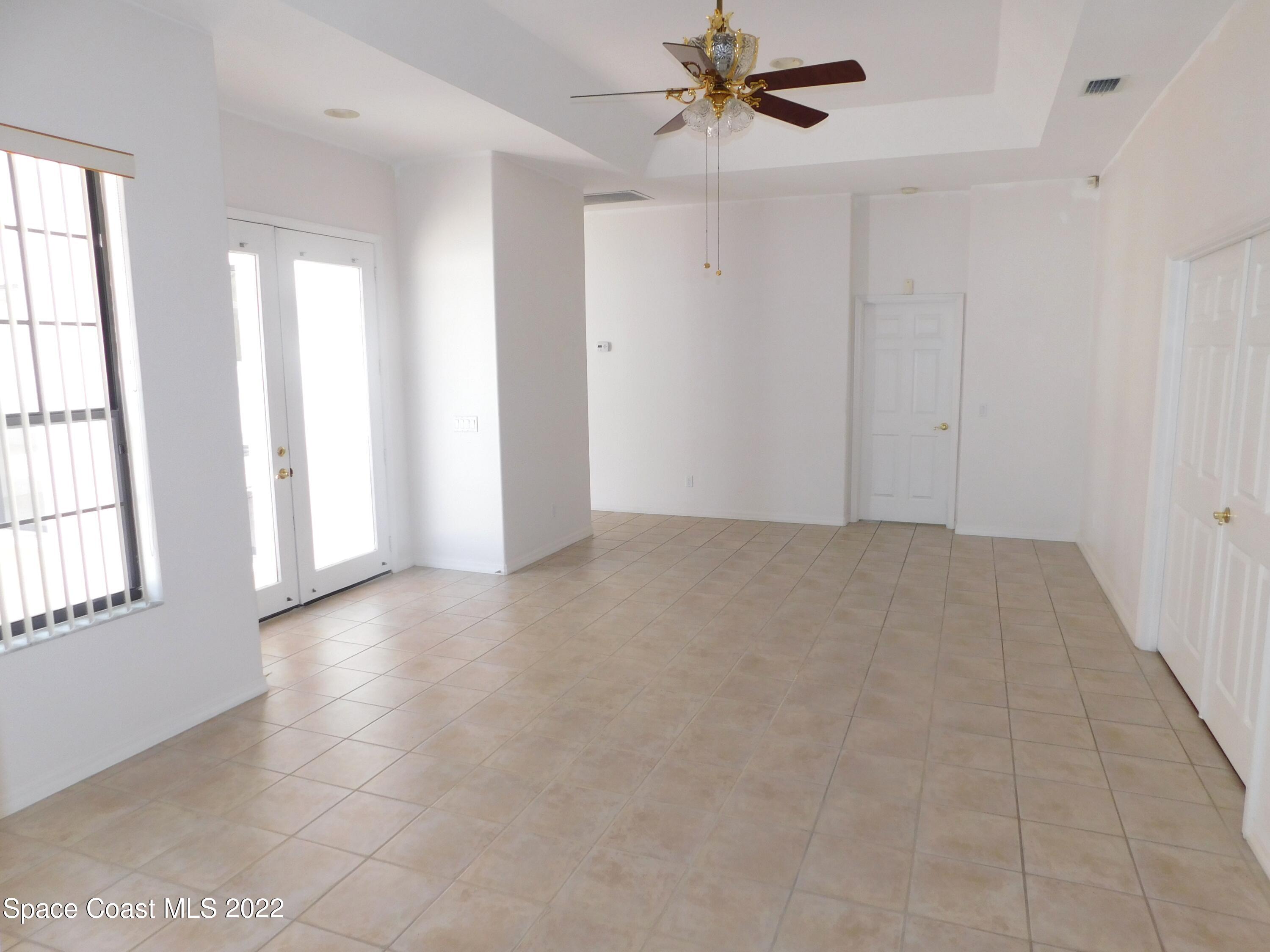 4508 Canard Road Melbourne, FL 32934 - Photo 9 of 34 a view of an empty room with a window