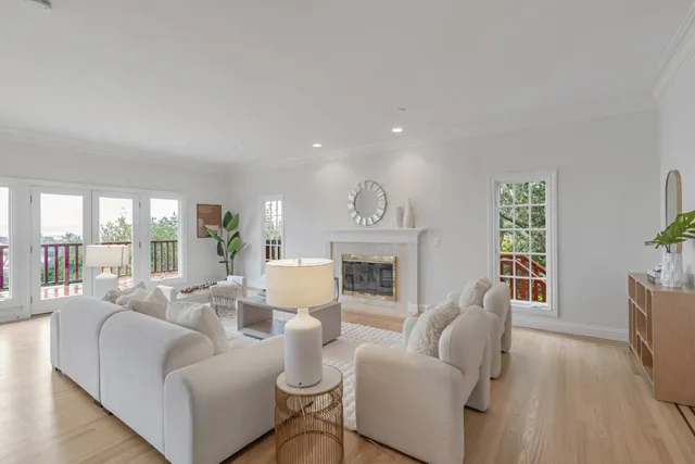 a kitchen with sink cabinets and living room view