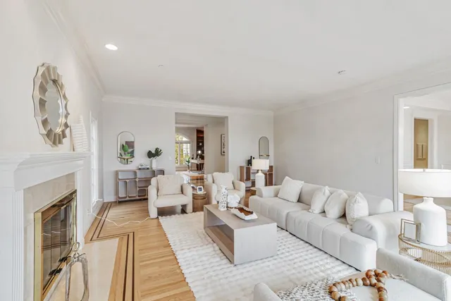 a kitchen with stainless steel appliances a stove a white cabinets and a potted plant