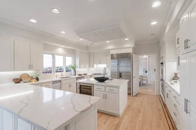 a living room with furniture a large window and table