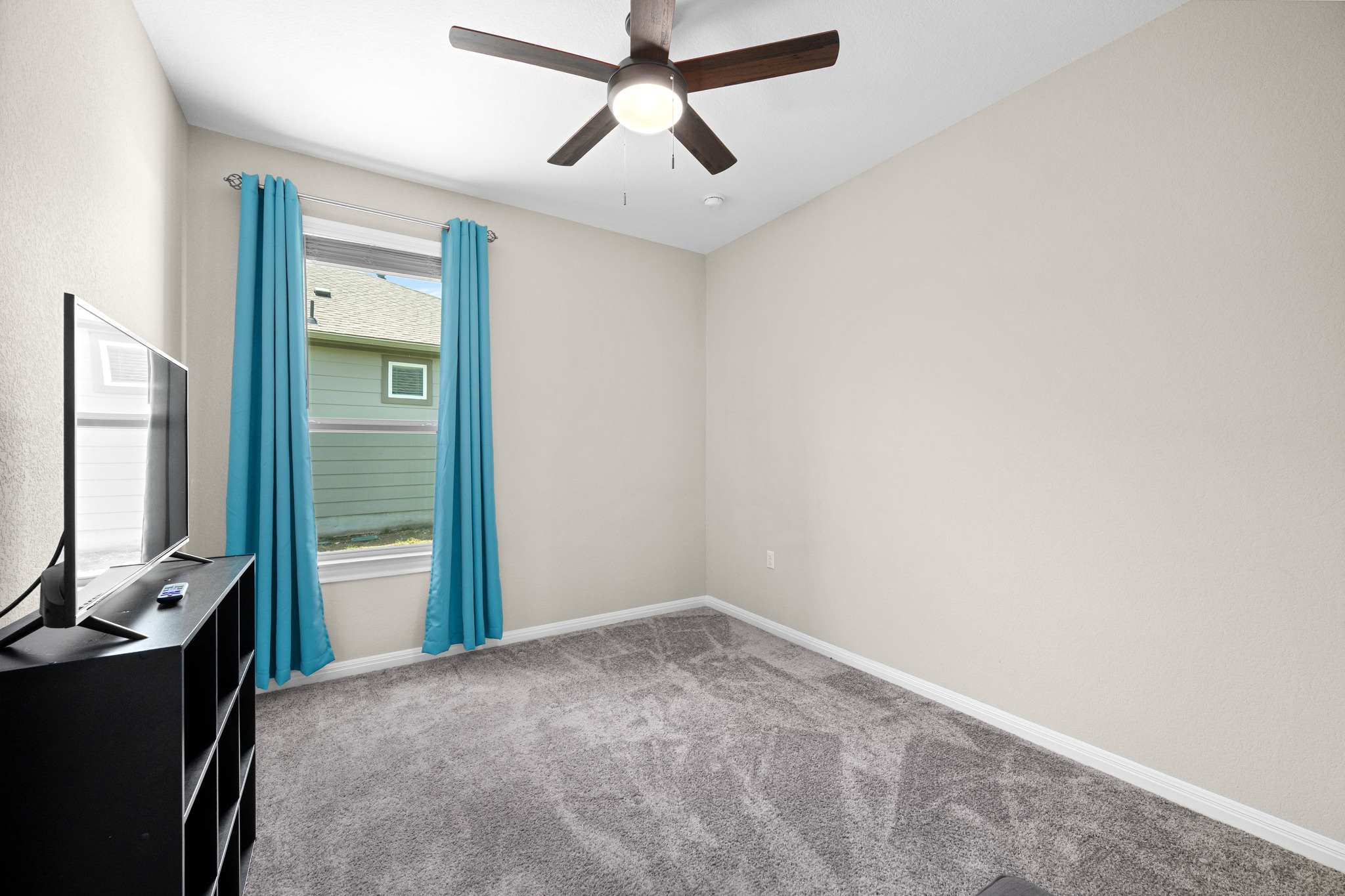 202 Yorktown Street Georgetown, TX 78633 - Photo 14 of 35 The secondary bedroom allows for natural light and is quietly tucked on the other side of the home with an adjacent full bath.