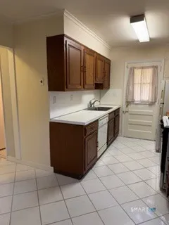 a kitchen with stainless steel appliances a sink and a refrigerator
