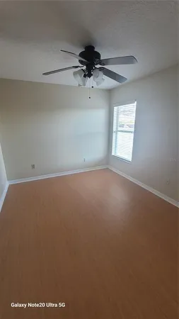 a bathroom with a bathtub a shower and a shower