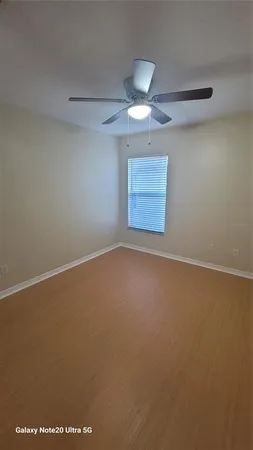 an empty room with a empty space and windows