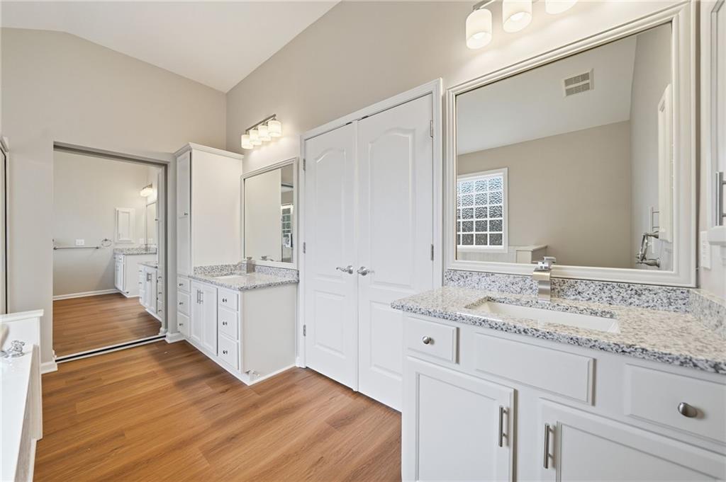309 Jessica Way Canton, GA 30114 - Photo 14 of 27 a bathroom with a sink and a mirror