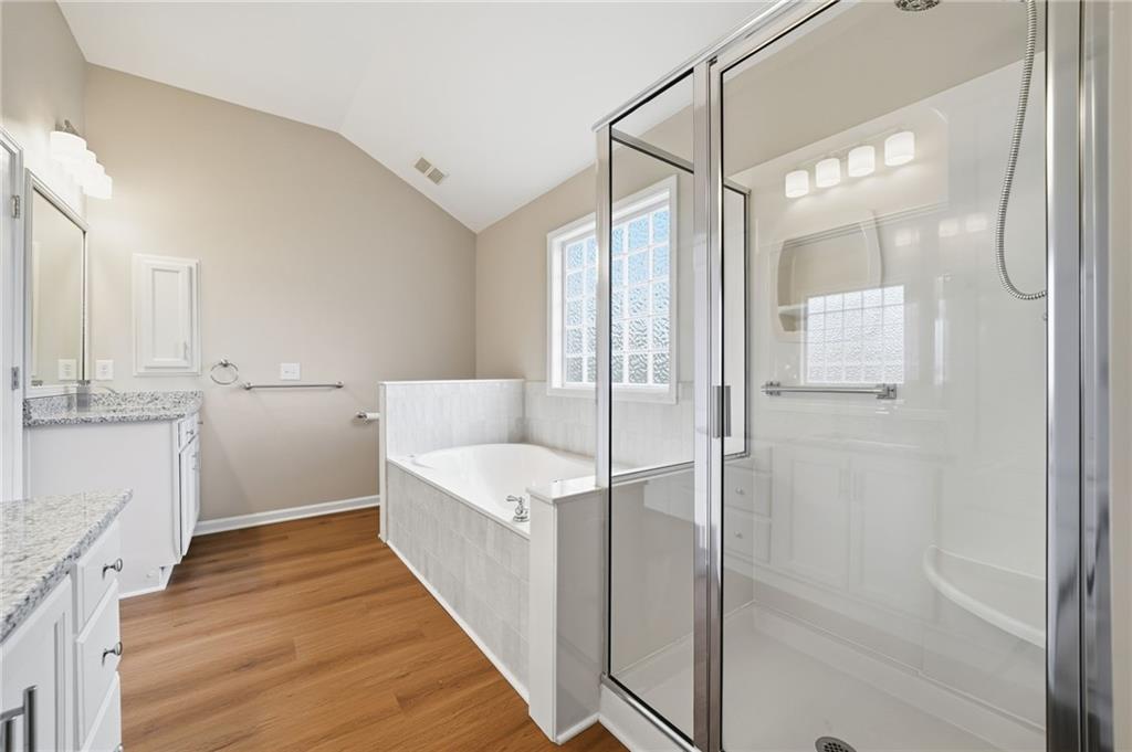 309 Jessica Way Canton, GA 30114 - Photo 15 of 27 a bathroom with a sink a toilet and shower