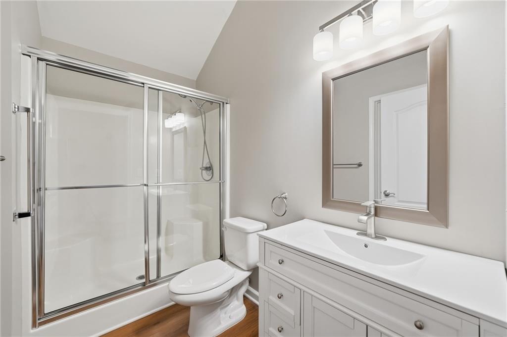 309 Jessica Way Canton, GA 30114 - Photo 18 of 27 a bathroom with a sink a toilet and a mirror