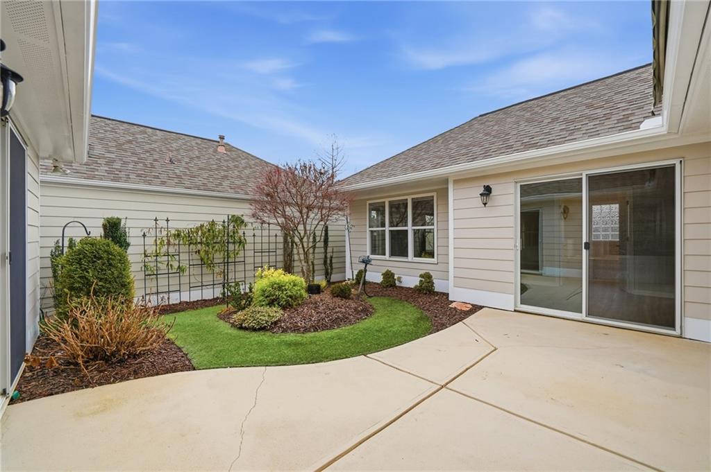 309 Jessica Way Canton, GA 30114 - Photo 19 of 27 a front view of a house with garden
