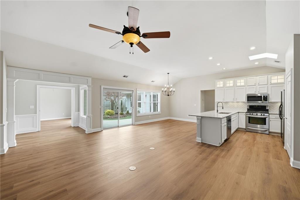 309 Jessica Way Canton, GA 30114 - Photo 7 of 27 a view of a kitchen with a sink stainless steel appliances and cabinets