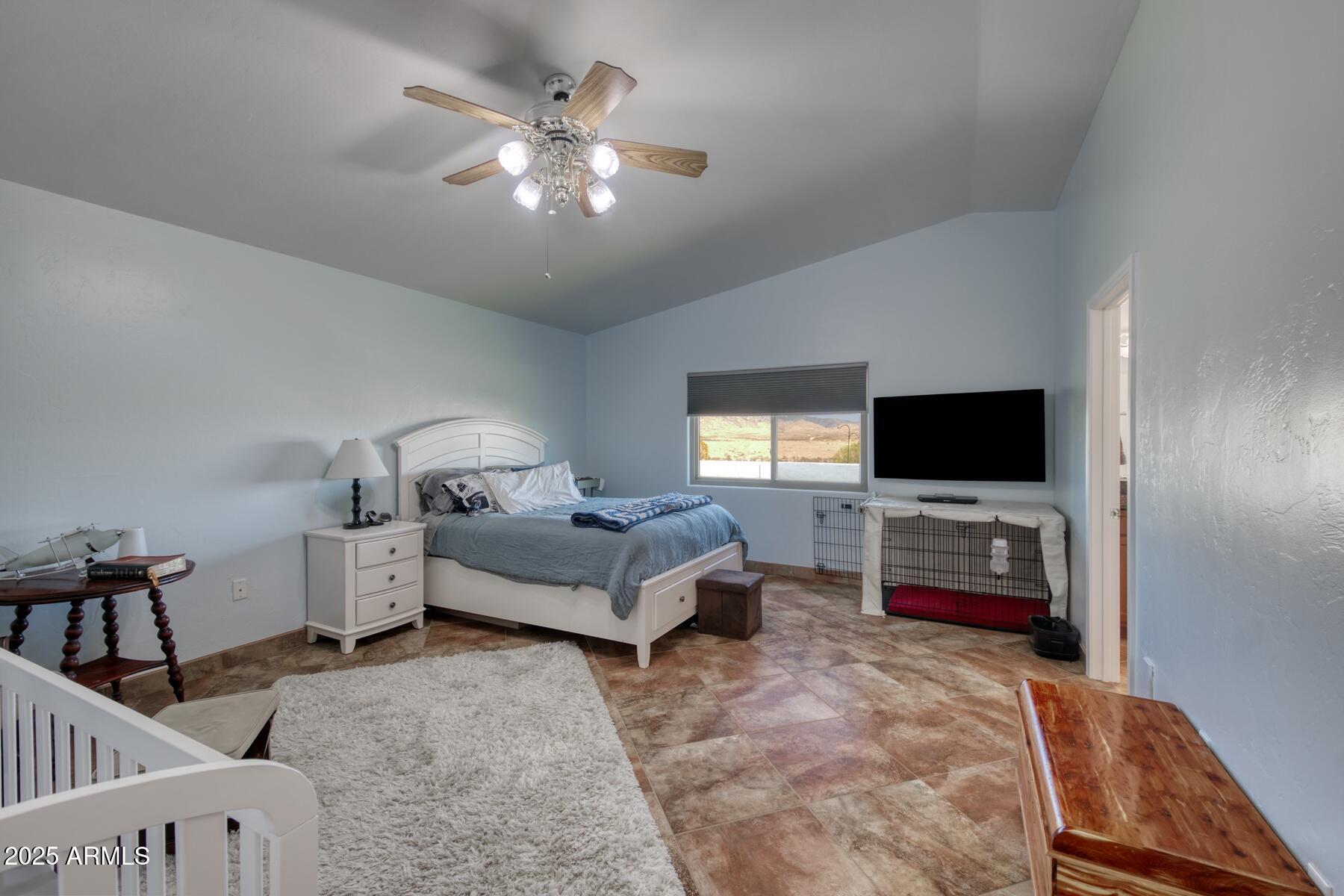 3298 West Monte Vista Trail Benson, AZ 85602 - Photo 18 of 44 a living room with furniture and a flat screen tv