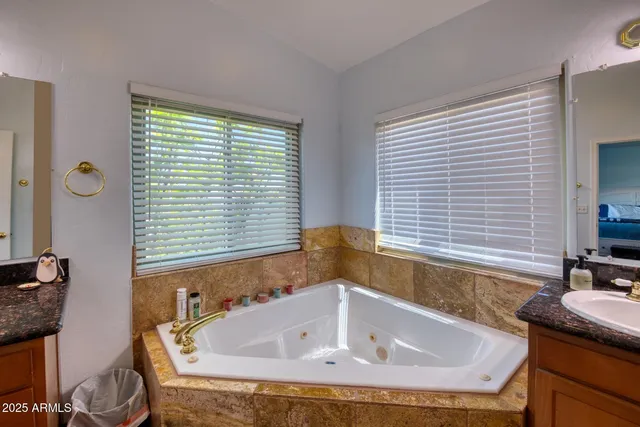 a kitchen with stainless steel appliances granite countertop a refrigerator and a stove