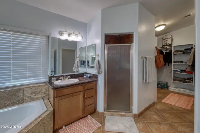 a room with wooden floor and cabinets