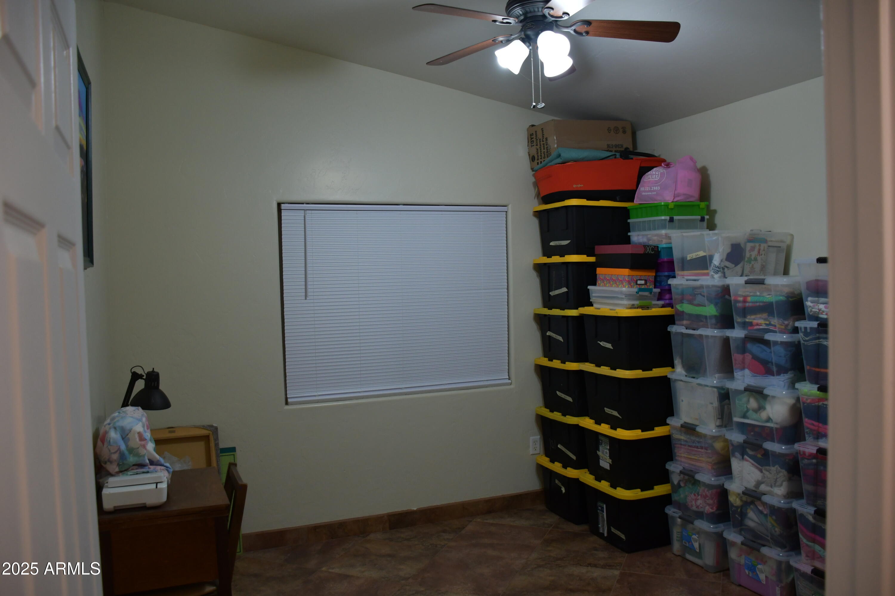 3298 West Monte Vista Trail Benson, AZ 85602 - Photo 25 of 44 a room with lots of different colored cloths