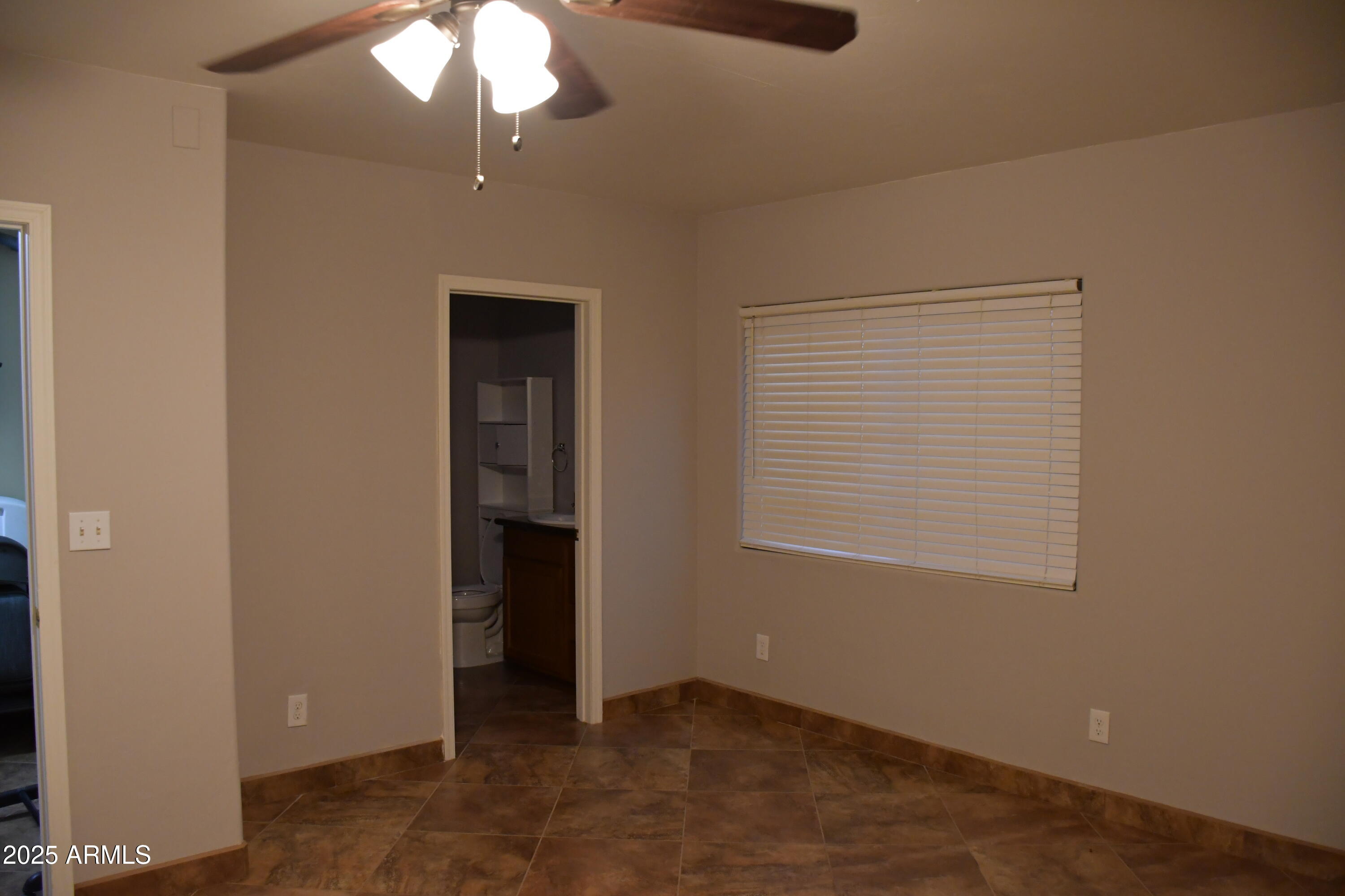 3298 West Monte Vista Trail Benson, AZ 85602 - Photo 27 of 44 an empty room with a window