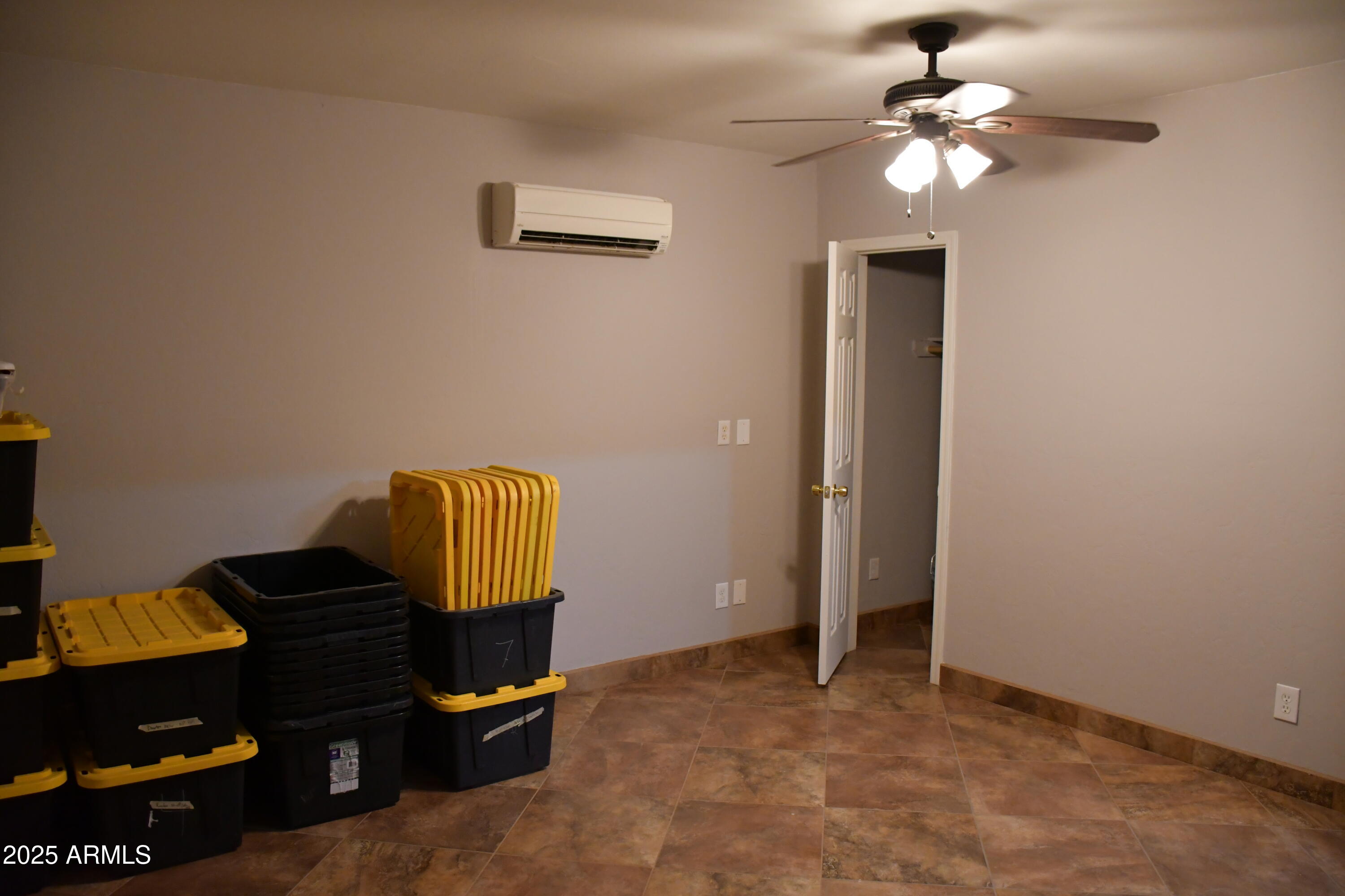 3298 West Monte Vista Trail Benson, AZ 85602 - Photo 28 of 44 a living room with furniture and a ceiling fan