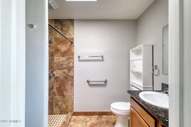 a view of a porch with furniture and a yard