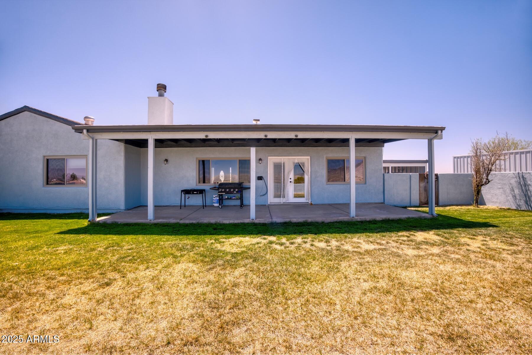3298 West Monte Vista Trail Benson, AZ 85602 - Photo 33 of 44 a front view of a house with garden