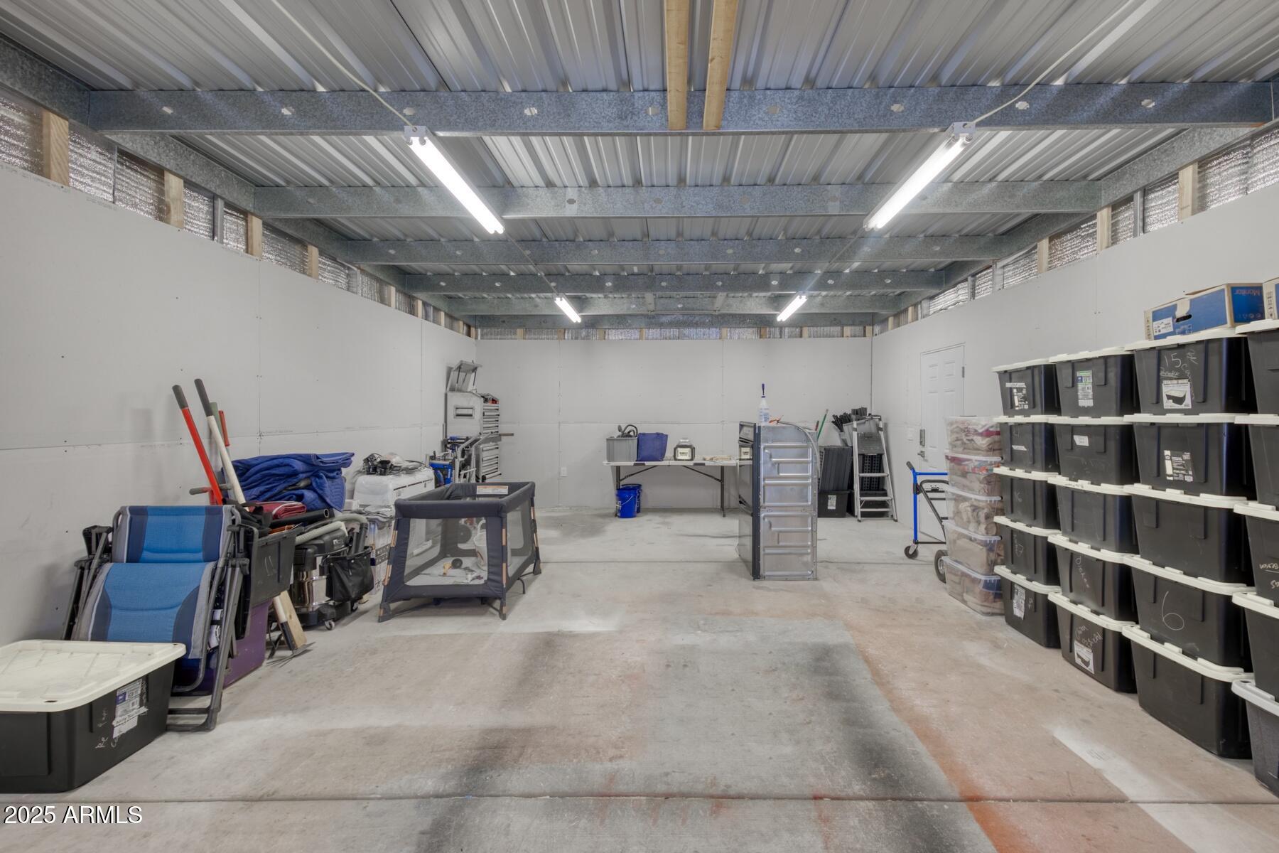 3298 West Monte Vista Trail Benson, AZ 85602 - Photo 37 of 44 a view of a storage room with racks