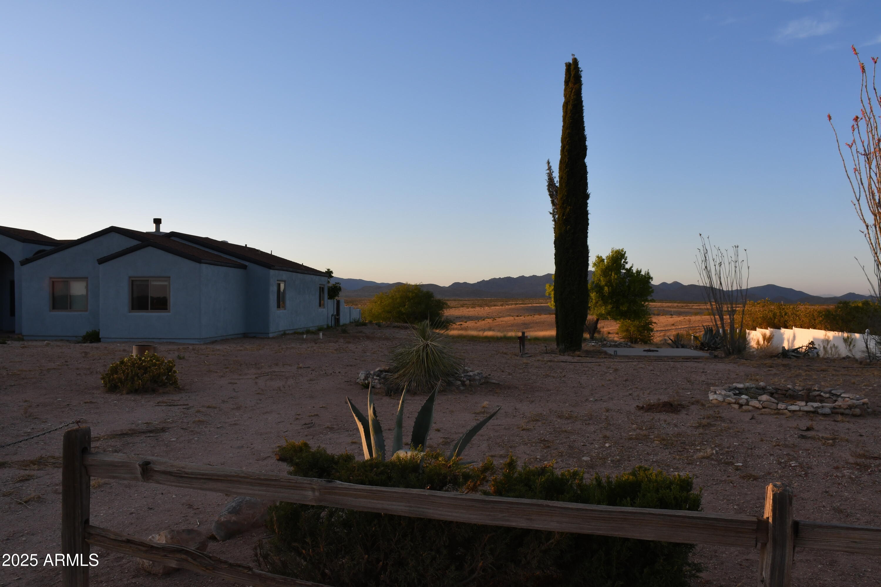 3298 West Monte Vista Trail Benson, AZ 85602 - Photo 41 of 44 a view of a house with a yard