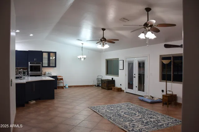a kitchen with stainless steel appliances granite countertop a stove and a refrigerator