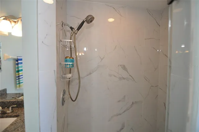 a spacious bathroom with a sink mirror and a bathtub next to a window