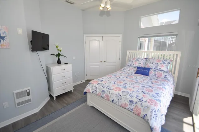 a bedroom with a bed and a mirror