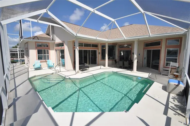 a view of a room with furniture and wooden floor