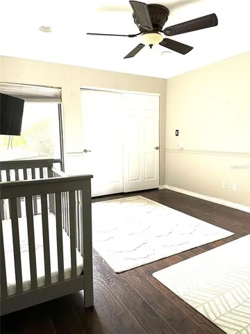 a bedroom with a bed and a night stand