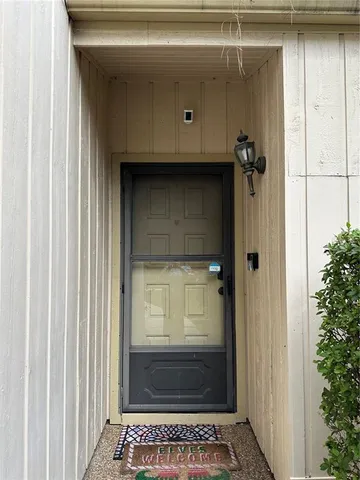 a kitchen with stainless steel appliances granite countertop a stove sink refrigerator and cabinets