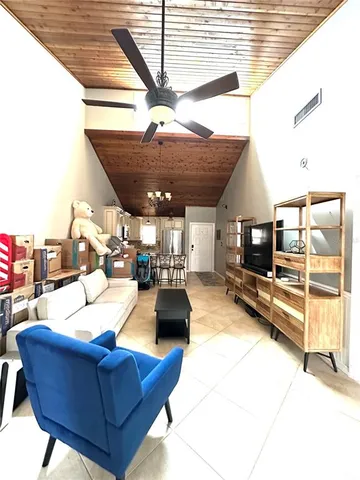 a bathroom with a granite countertop toilet a sink and a shower